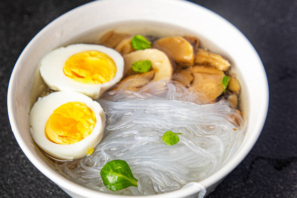 soup rice noodles funchose, egg, mushrooms Pho Bo delicious snack healthy meal food snack on the table copy space food background rustic top view - Photo, Image