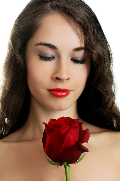 Young beautiful woman holding red rose - Foto, Imagen