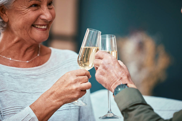 Senior couple, champagne and toast at restaurant, having fun and bonding. Love, cheers and retired man and woman with glass of wine for celebration, anniversary or birthday and enjoying time together. - Foto, immagini