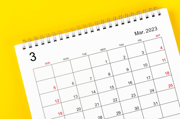 March 2023 Monthly desk calendar for 2023 year on yellow background. - Foto, Imagem