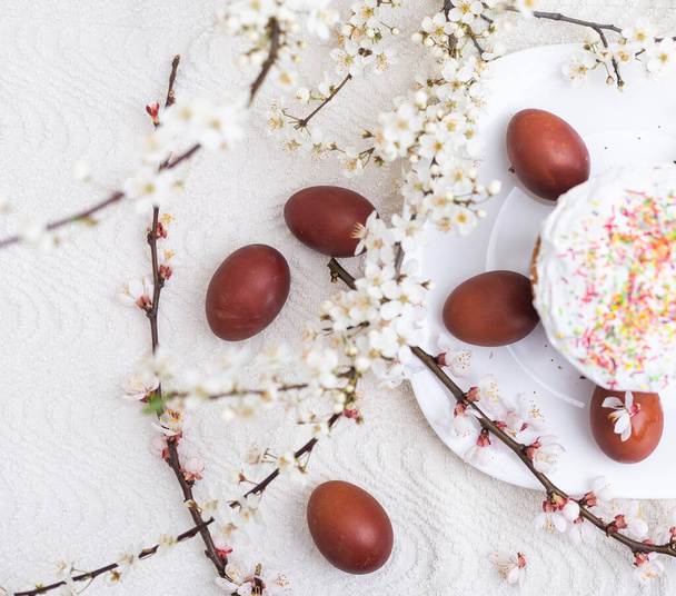 easter cake and red eggs on rustic wooden table. Top view - Valokuva, kuva