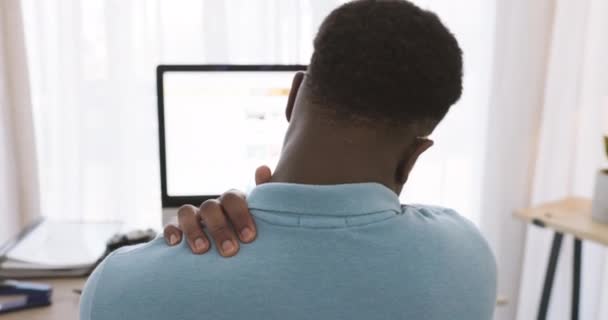 Black man, shoulder pain and stress working on pc for remote work, overworked freelance business or frustrated entrepreneur in home office. African person, burnout and arm injury sitting at computer. - Footage, Video