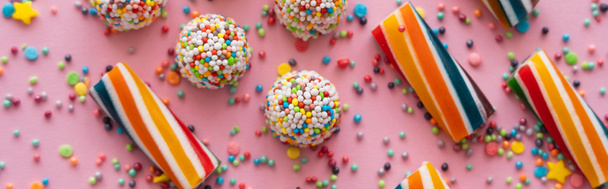 Top view of delicious sweets and sprinkles on pink background, banner  - Φωτογραφία, εικόνα