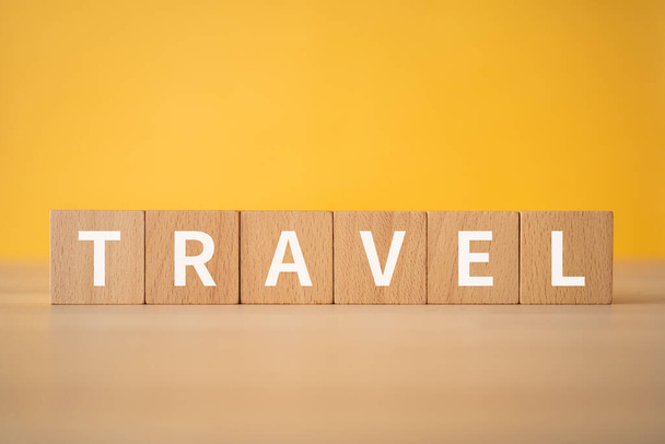 Wooden blocks with "TRAVEL" text of concept. - Photo, Image