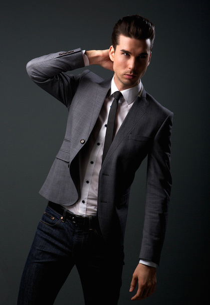 Attractive young male fashion model in suit jacket and tie - Foto, afbeelding