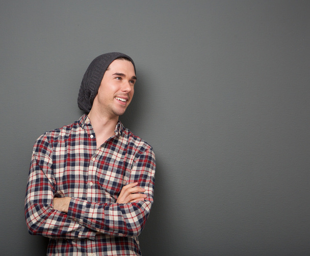 Cheerful young man in checkered shirt - Photo, Image