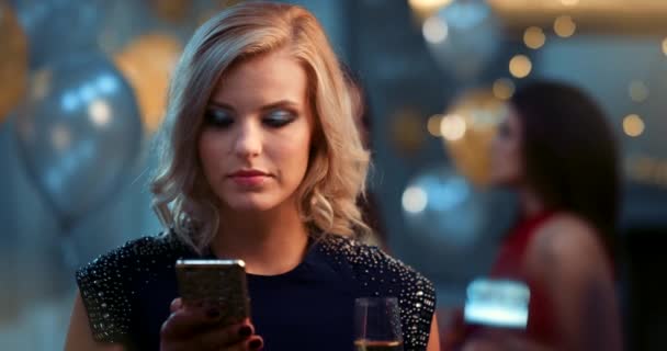 Phone, champagne and woman at a party or celebration networking on social media or the internet. Wine, technology and happy lady reading a funny text message or post on her smartphone at an event - Imágenes, Vídeo