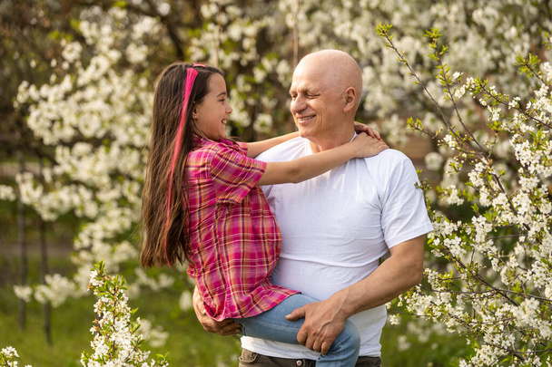Grandfather And granddaughter on flower farm, - Foto, Bild