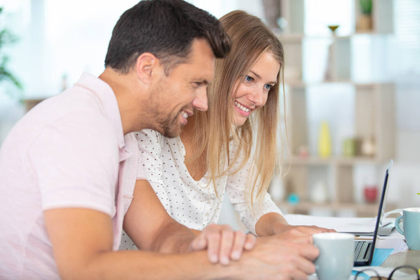 young couple managing finances at home - Foto, Imagem