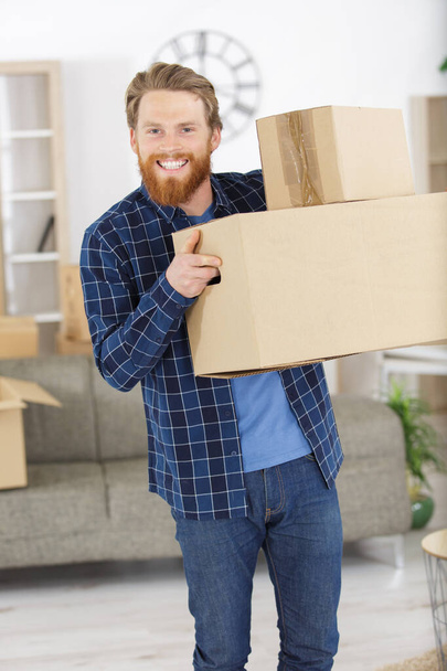 happy young man with boxes - Fotoğraf, Görsel