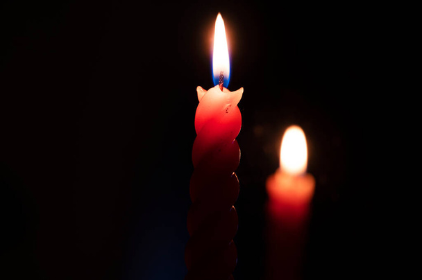 burning red candles in the dark - Photo, Image