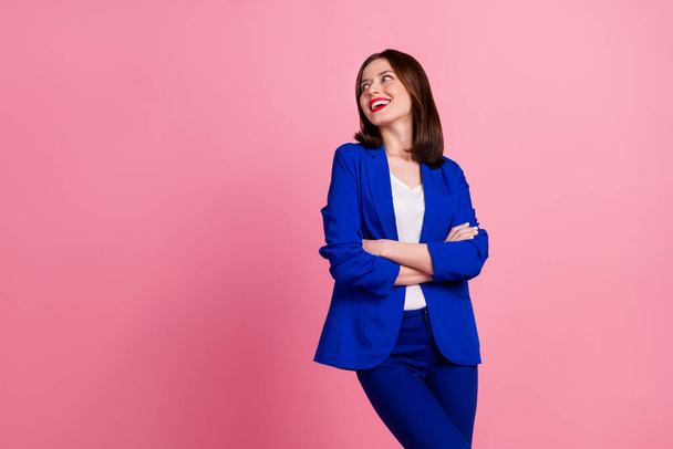 Photo of cheerful cute lady dressed fashionable clothes interested look empty space proposition discount isolated on pink color background. - 写真・画像