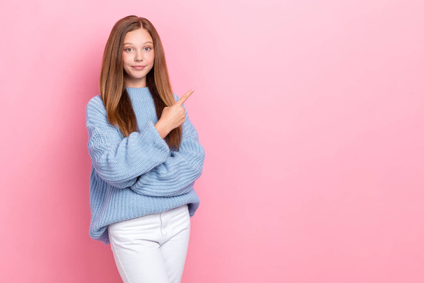 Photo of pretty serious lady dressed stylish cozy sweater arm demonstrate empty blank space banner board isolated on pink color background. - Фото, изображение