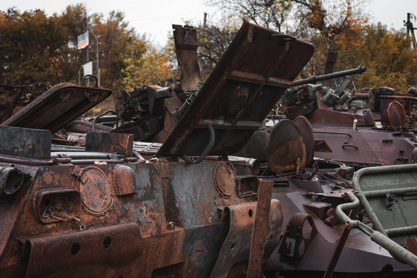 War in Ukraine, cemetery of Russian equipment, destroyed military equipment. Izyum city, Kharkiv region. - Photo, Image