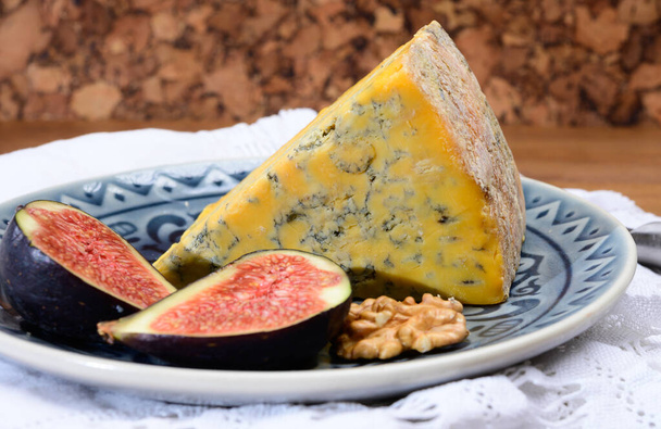 Cheese collection, English old shropshire blue cheese close up served with fresh figs - Photo, Image