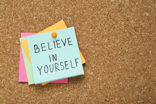 Notes with phrase Believe In Yourself and space for text on corkboard, top view. Motivational quote - Valokuva, kuva