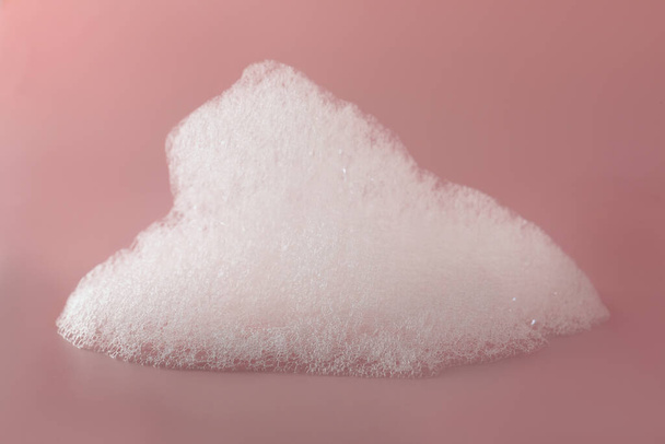 Fluffy bath foam on pink background, closeup - Zdjęcie, obraz