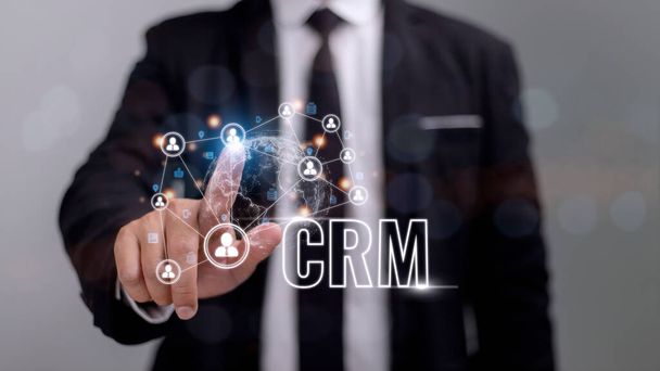CRM Customer Relationship Management for business sales marketing system concept presented in futuristic graphic interfaz of service application to support CRM database analysis. - Foto, imagen