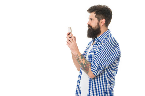 bearded man blogger making photo with copy space. man blogger with phone isolated on white background. blogger man in studio. photo of man blogger. - Foto, Bild