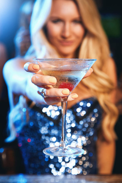 Party, nightclub and woman with cocktail in hand ready for celebration, toast and cheers on dance floor. Social event, happy hour and closeup of girl with alcoholic drink at disco, rave and club. - 写真・画像