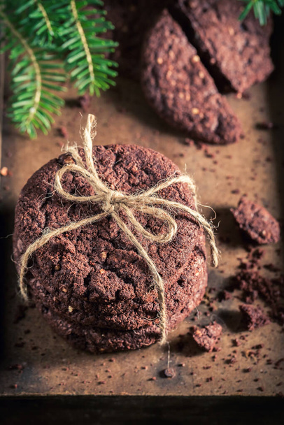 Sweet and homemade chocolate cookies with nuts for Christmas. Little cookies made of cocoa and nuts. - Фото, зображення