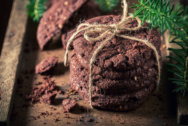 Sweet and brown chocolate cookies made for Christmas Eve. Little cookies made of cocoa and nuts. - Foto, Imagem