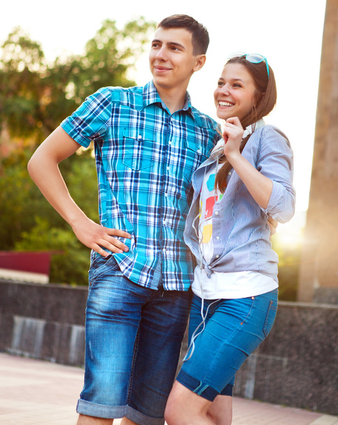 Students or teenagers outdoors in summer evening - Photo, image
