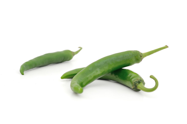Fresh green chili peppers on a white background - Photo, Image