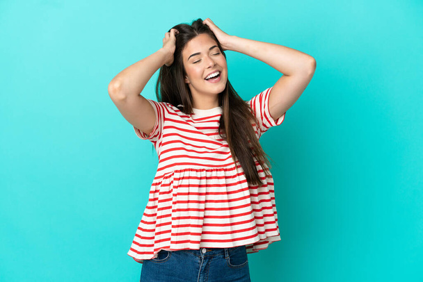 Young Brazilian woman isolated on blue background laughing - Fotografie, Obrázek