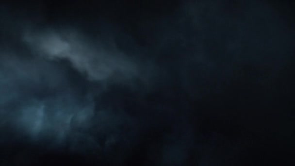 Atmospheric smoke in 4K slow-motion. Hazed background. Abstract swirling smoke cloud. High-end premium element for visual effects. Smoke slowly floats through space against the black background. - Footage, Video