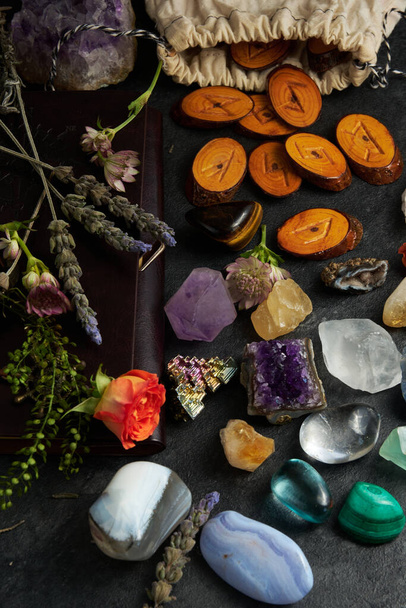 various gem stones and runes on dark background - Foto, Bild