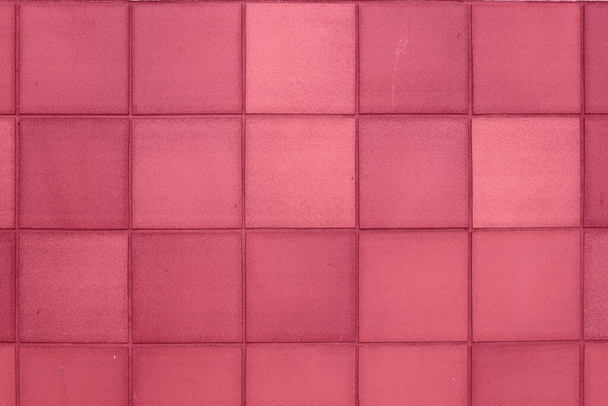 Color of year 2023 Viva Magenta. Image with aged square tiles are toned in pantone color of viva magenta. New Fashion colour. Clay Tile Flooring texture. Red stone clay quarry tiled floor detail - Valokuva, kuva