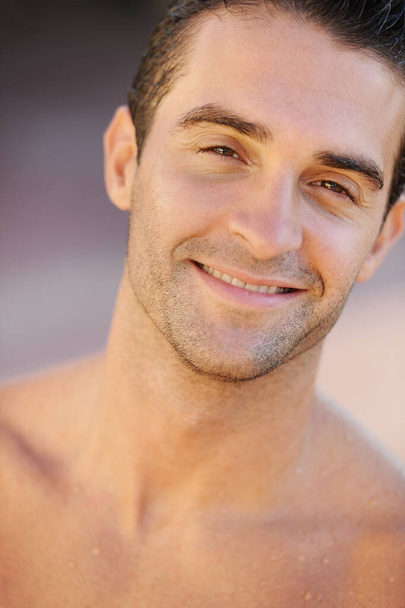 Hunky handsomeness. Closeup of a handsome young topless man smiling at the camera - Fotografie, Obrázek