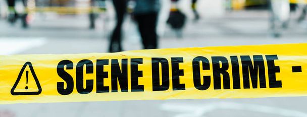 yellow tape to mark off a crime scene in the street - Foto, Imagen