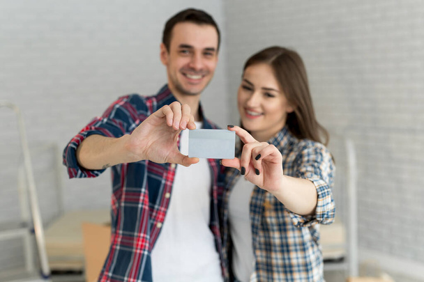Couple buying online with credit card and phone - Foto, Bild