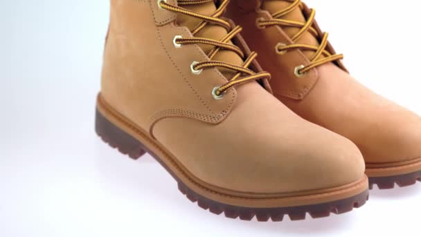 Close up view of winter yellow  men's boots isolated on background. - Footage, Video