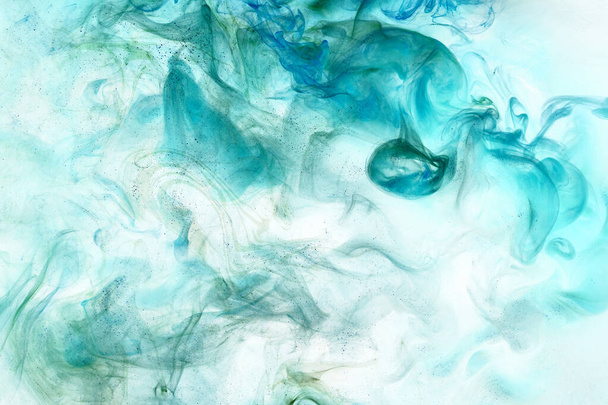 Emerald green ink abstract background. Acrylic paint backdrop for perfume, hookah, cosmetics. Mysterious smoke clouds, colorful fog - Photo, Image