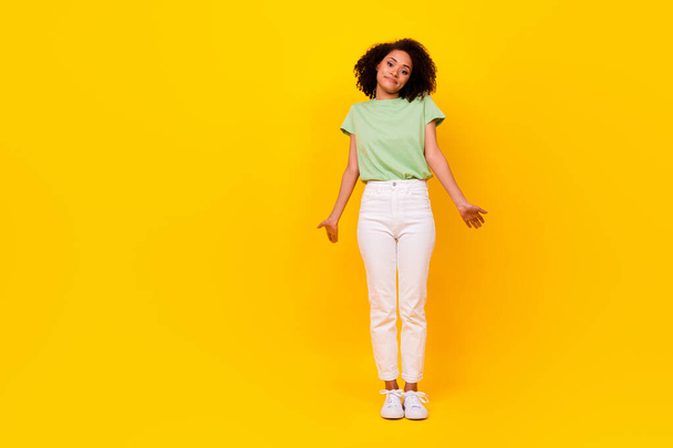 Full body size photo of young adorable gorgeous nice woman palms out dont know indifferent your problems isolated on yellow color background. - Φωτογραφία, εικόνα