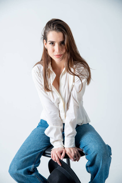 beautiful young woman posing in studio - Photo, image