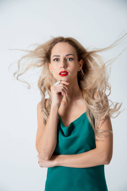beautiful blonde woman posing in studio - Fotó, kép