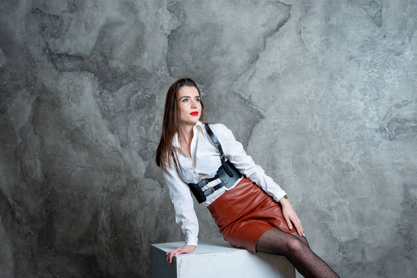 beautiful sexy woman posing in studio against gray wall - Zdjęcie, obraz