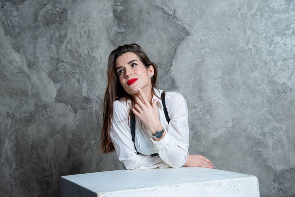 beautiful sexy woman posing in studio against gray wall - Foto, Imagem