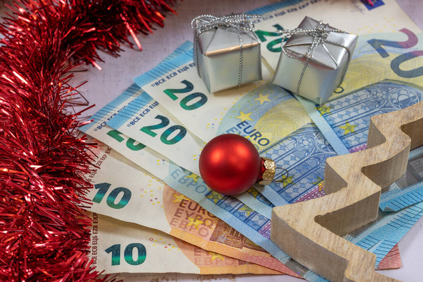 background with banknotes and christmas decoration - Foto, Bild