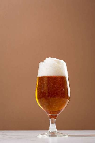 Overflowing beer foam craft alcohol background copy space - Fotó, kép