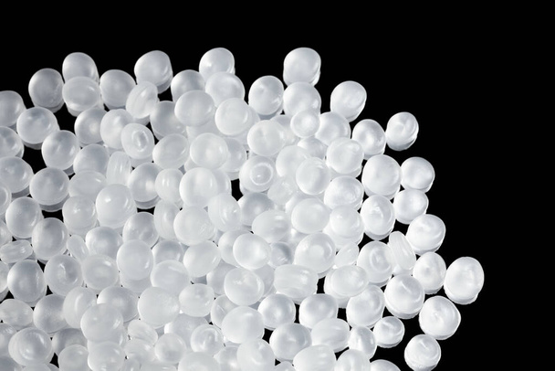 Close up picture of polypropylene granules, selective focus. - Foto, afbeelding