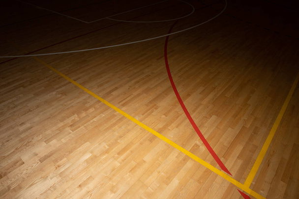 Wooden floor basketball, badminton, futsal, handball, volleyball, football, soccer court. Wooden floor of sports hall with marking lines on wooden floor indoor, gym court - 写真・画像