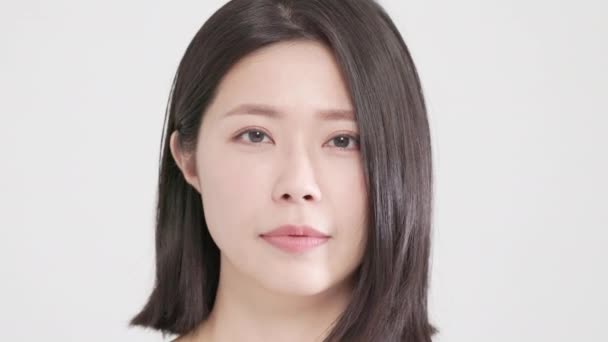 Detailní asijské mladá kráska Usmívající se péče o obličej, žena, žena, osoba, tvář,  - Záběry, video