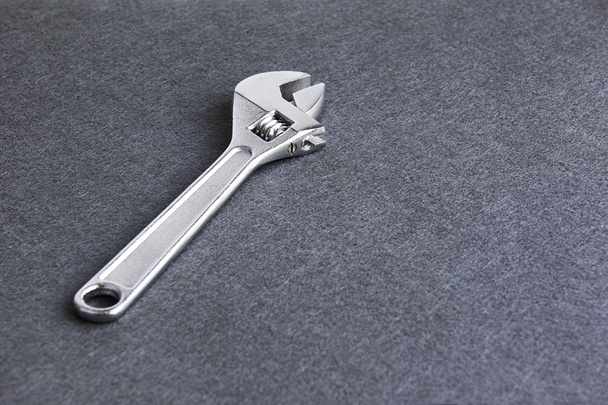 Adjustable wrench in grey background - Photo, Image