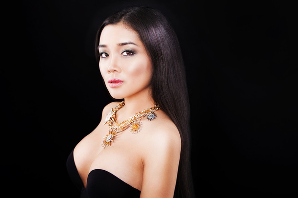 portrait of a beautiful asian girl with luxury accessories. fashion model - Фото, изображение