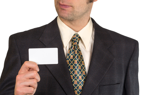Man's hand is showing business card. He is in black suit, white  - Fotoğraf, Görsel